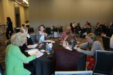 Dr. Lynda Powell and fellows during a small group discussion